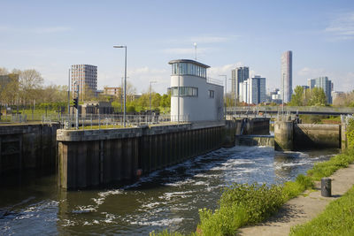 The weir at the modern three mills lock near stratford, london