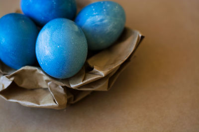 High angle view of multi colored eggs on table