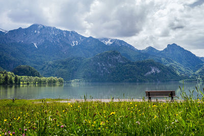 Scenic view of lake and mountains against sky