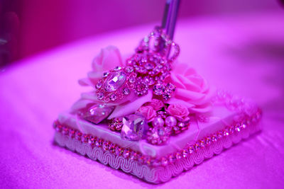 Close-up of purple flower on table