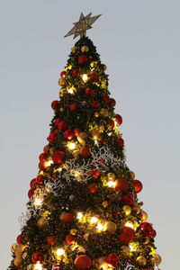 Low angle view of christmas tree against sky