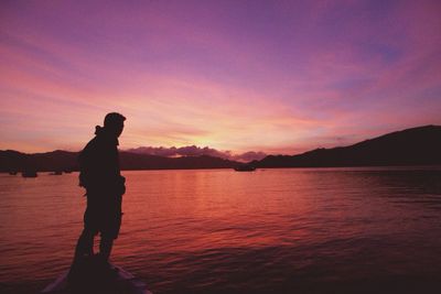 Scenic view of lake at sunset