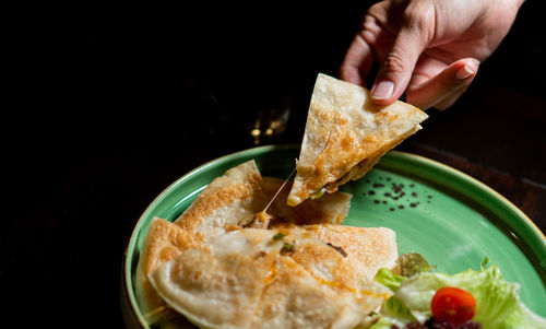 Close-up of hand holding food