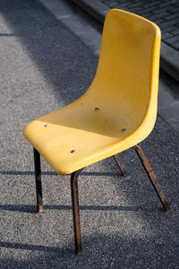 High angle view of empty bench on road