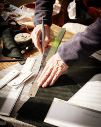 High angle view of people working on table