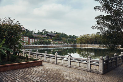 Bridge over lake against sky