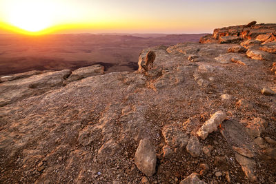 Scenic view of rocks during sunset