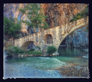 Arch bridge over river