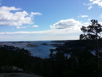 Scenic view of sea against cloudy sky