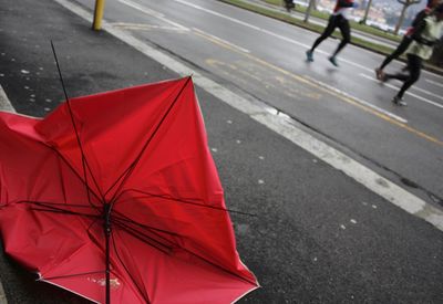 People walking on road in rainy season