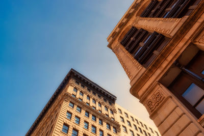 Low angle view of building against blue sky