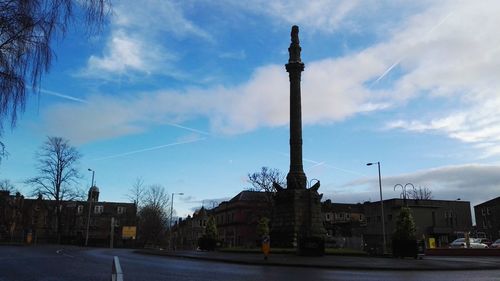 City street against cloudy sky