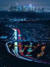 Illuminated city buildings at night