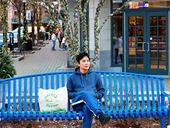 Portrait of woman sitting on chair