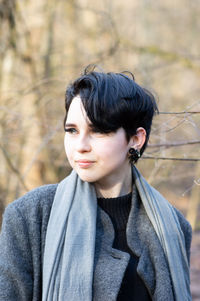 Portrait of young woman looking away