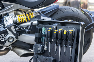 A case of technical instruments standing next to the motorcycle