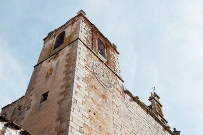 Low angle view of old building against sky