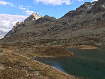 Scenic view of lake and mountains against sky