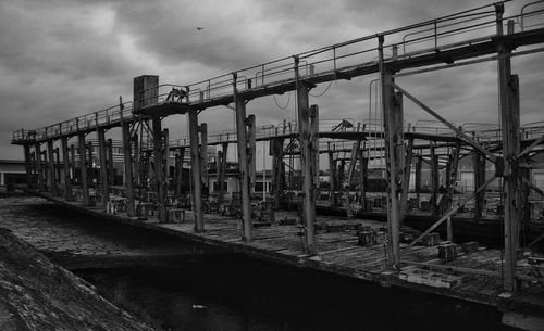 Old fishing wharf against sky