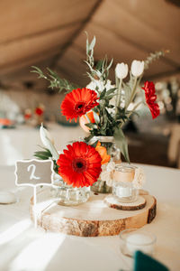 Close-up of red roses in vase on table