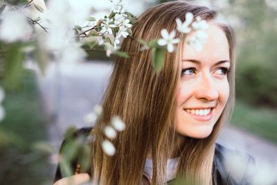 Portrait of smiling young woman outdoors