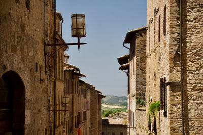 Low angle view of old buildings in san gimignano, an italian town in tuscany, southwest of florence
