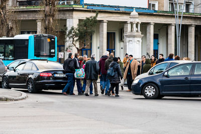 Group of people on road in city