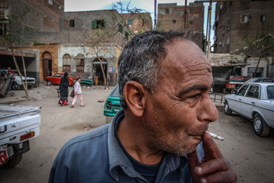 Portrait of man in city street