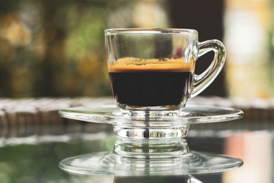 Close-up of coffee cup on table