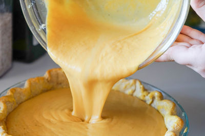 Close-up of hand holding ice cream