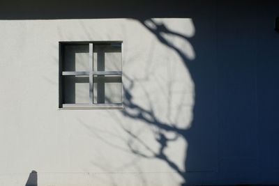 Low angle view of window on wall of building