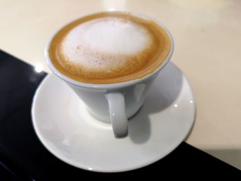 High angle view of coffee cup on table