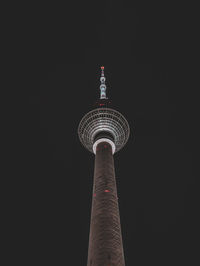 Low angle view of lighthouse against black background