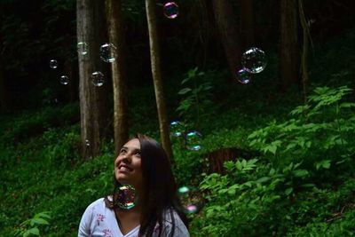 Young woman in bubbles