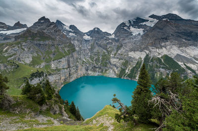 Scenic view of lake and mountains against sky