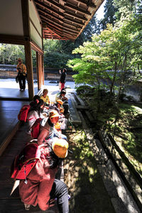 Group of people in front of built structure