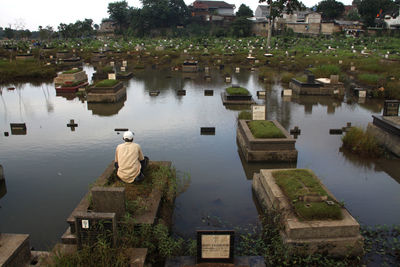 High angle view of man standing by river