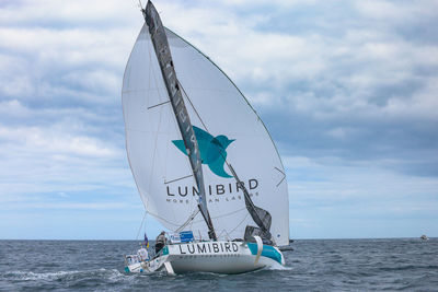 Sailboat on sea against sky