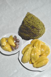 High angle view of lemon in plate on table