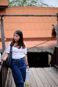 Portrait of woman standing outdoors