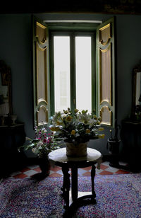 Flower vase on table at home