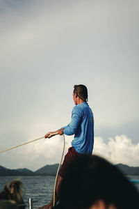  man on sea against sky