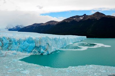 Scenic view of glacier against sky