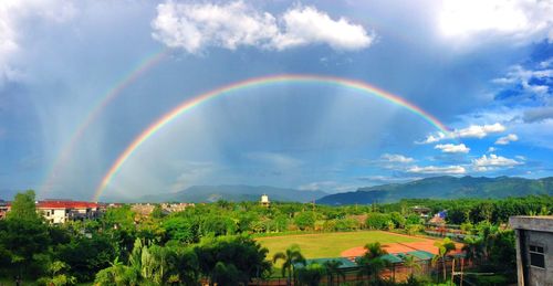 Scenic view of rainbow over landscape