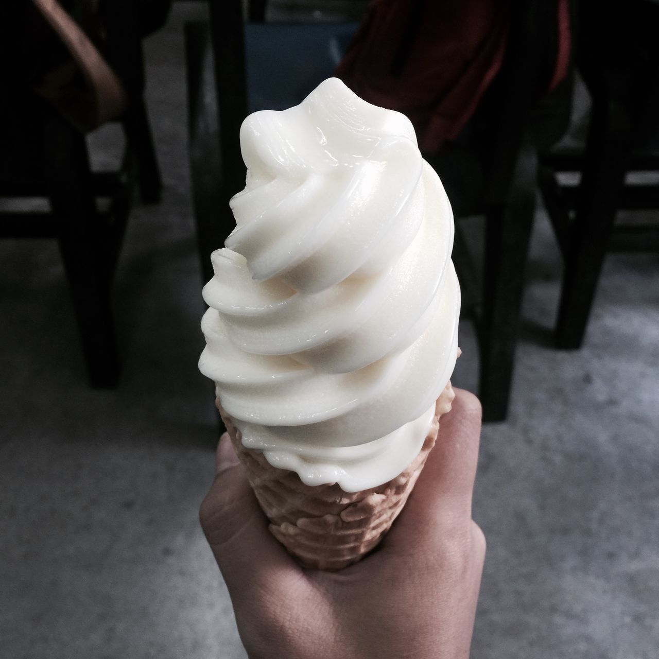 person, holding, sweet food, food and drink, frozen food, ice cream, dessert, freshness, food, indulgence, unhealthy eating, part of, cropped, ice cream cone, focus on foreground, close-up, lifestyles