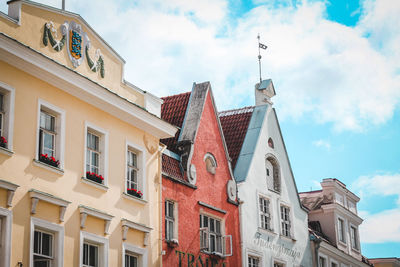 Low angle view of buildings against sky in tallinn, estonia. 