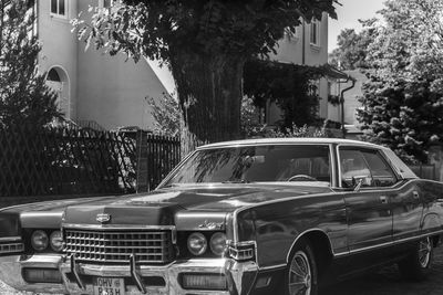 Cars on street by buildings in city