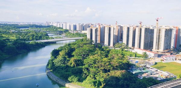 High angle view of road by buildings against sky