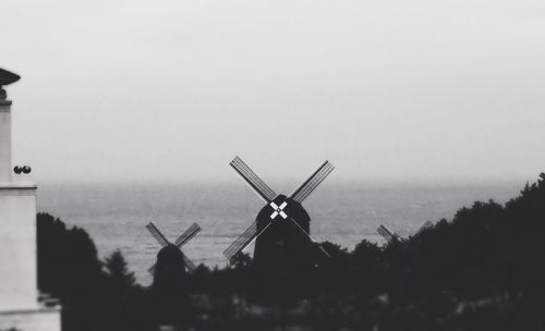 Traditional windmill against sky
