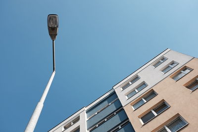 Low angle view of building against clear blue sky